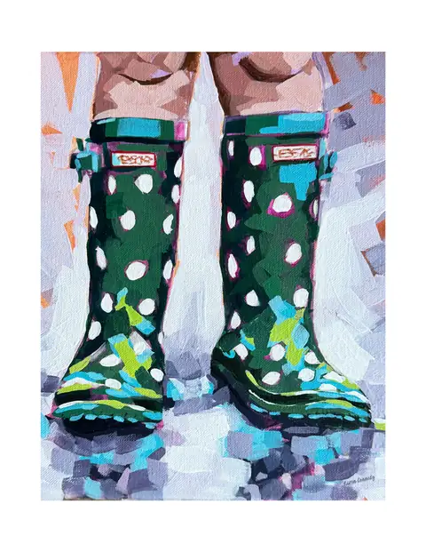 Green patterned rain boots standing in snow.